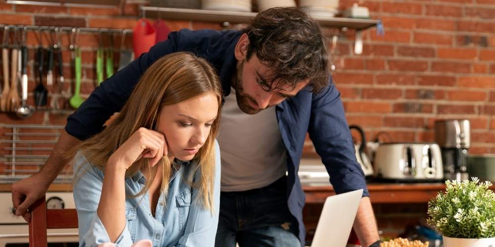 A couple in the process of creating a budget.