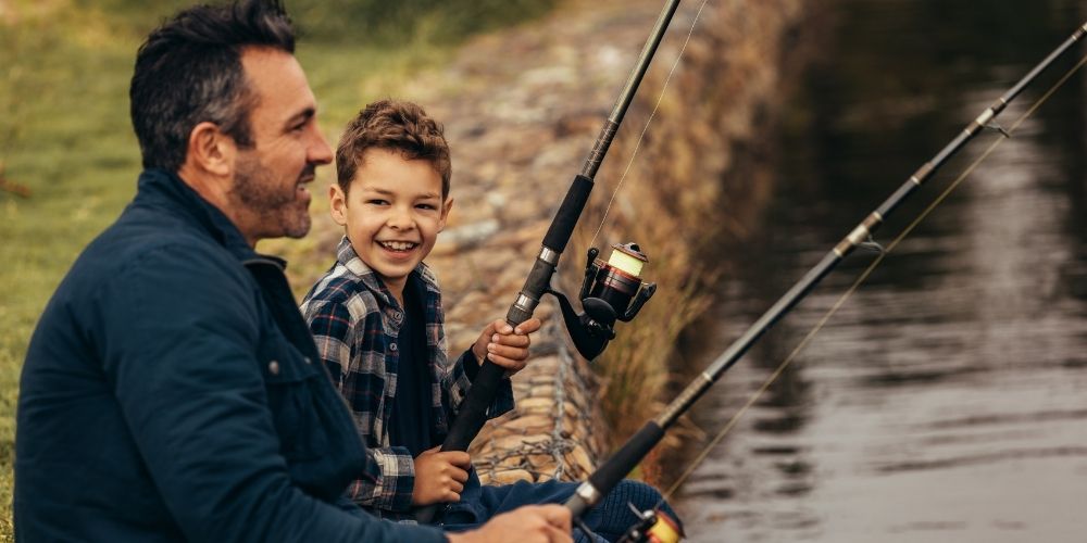 A dad fishing with his son.